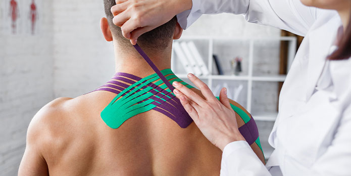 patient getting kinesio tape as an auto accident injury treatment in Fort Lauderdale